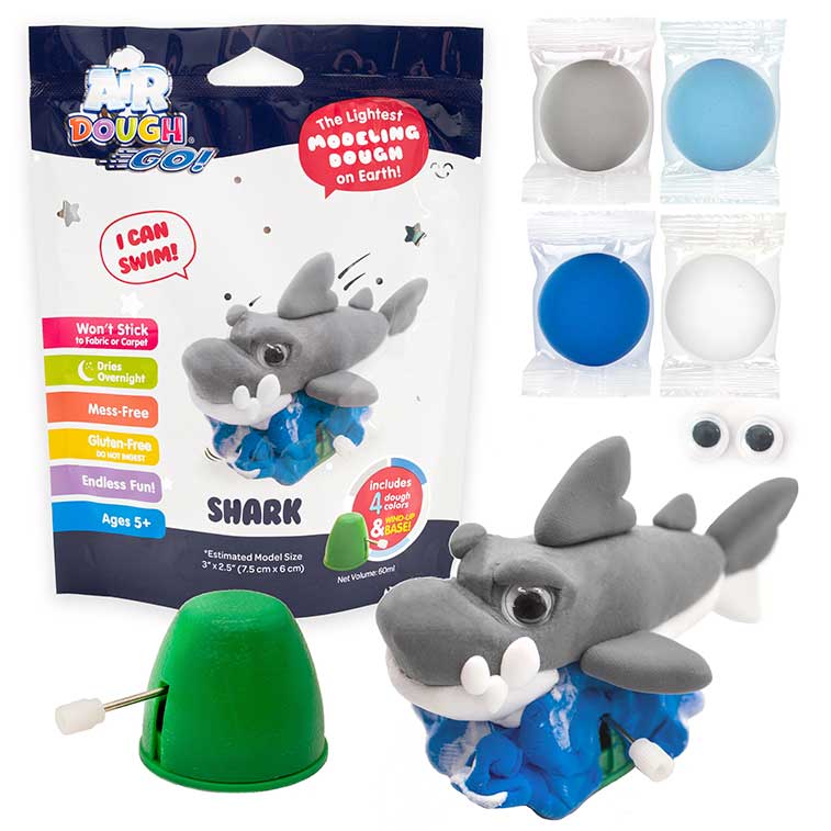 Blue and white Air Dough Go foil bag, grey Shark built with air dough the lightest, most amazing dough on earth, grey, lightblue, dark blue, and white packs of air dough, 1 pair of googly eyes, and a  wind-up mechanism