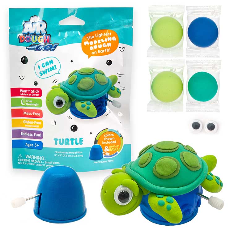 light blue and white Air Dough Go foil bag, orange tiger built with air dough the lightest, most amazing dough on earth, green, 2 light green, and blue packs of air dough, 1 pair of googly eyes, and a  wind-up mechanism