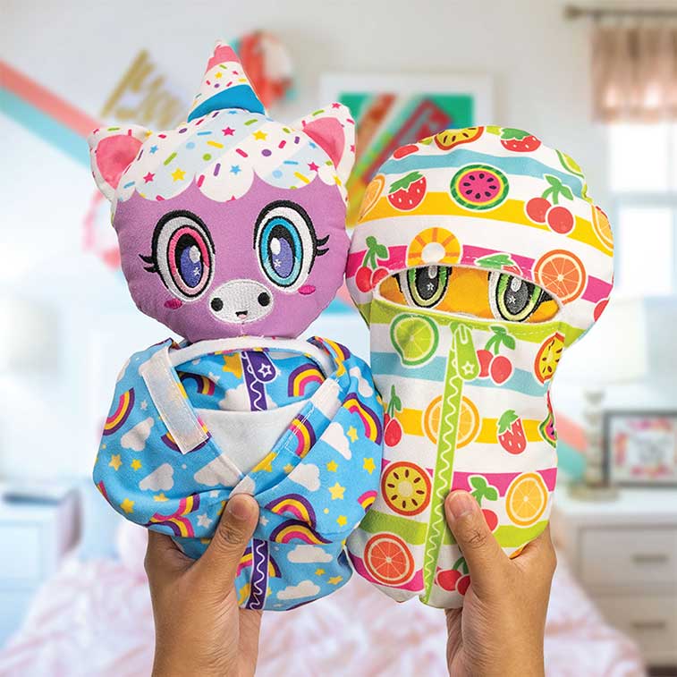 Birthday Cake Scented bedtime buddy Plush, purple,pink,blue, and white O.M.G. Snuggle Me! Unicorn and Pineapple Scented bedtime buddy Plush, green and yellow O.M.G. Snuggle Me! Kitty