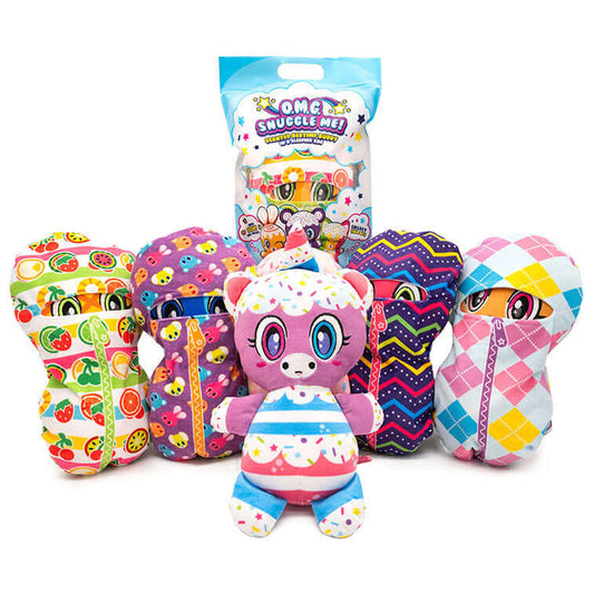 O.M.G. Snuggle Me! scented bedtime buddy Plush Group, 4 in their sleeping bags, 1 in the packiging, and 1 out of packiging