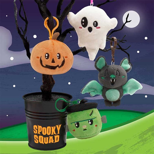Bundle of 4 Spooky Squad Backpack Buddies, Scented Plush clipped onto a black Halloween tree in a black spooky squad bucket with a background of of moon and dark sky
